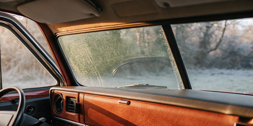 A car freshener for the crisp morning air, shown in a car with a frosted windshield.